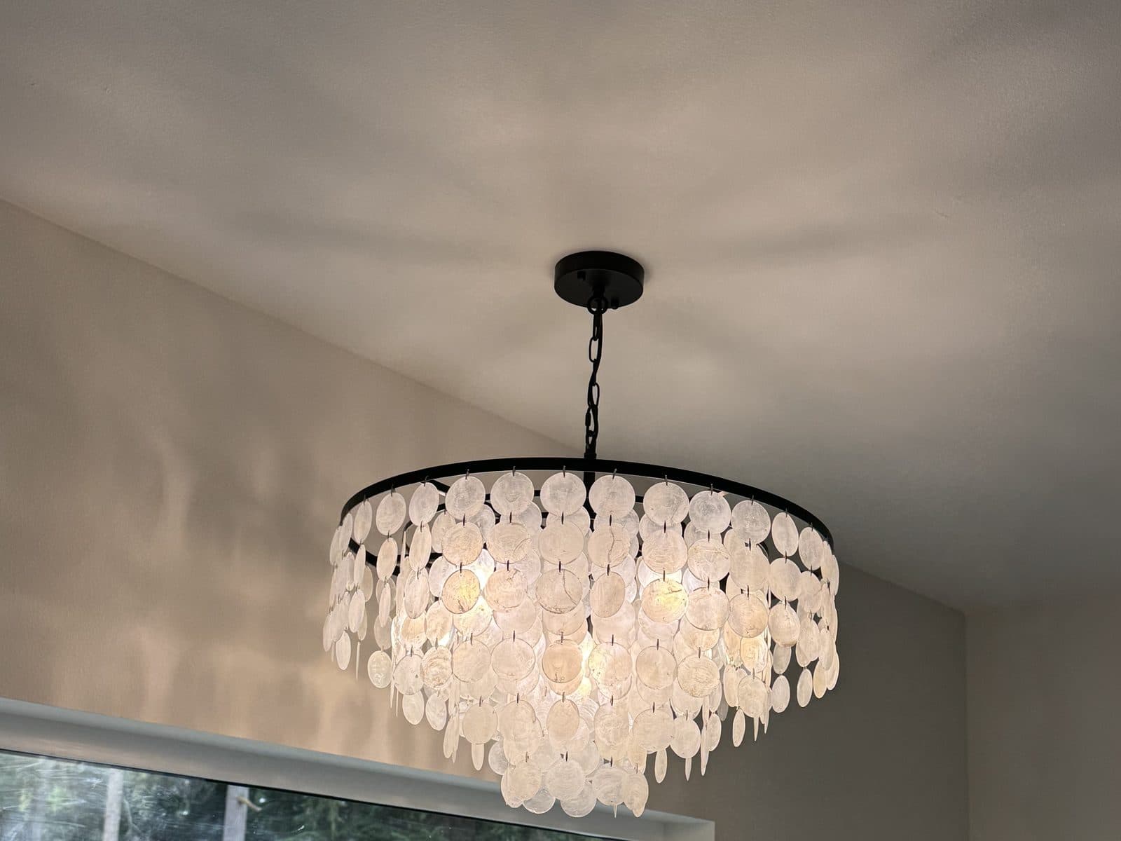 Capiz-shell chandelier installed in a new Seattle-area home